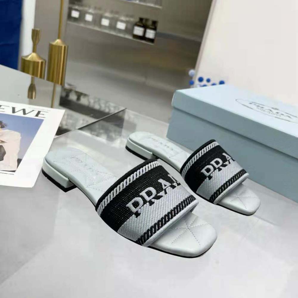 Back angle of Prada Women Embroidered Fabric Slides-Blue highlighting slip-on silhouette