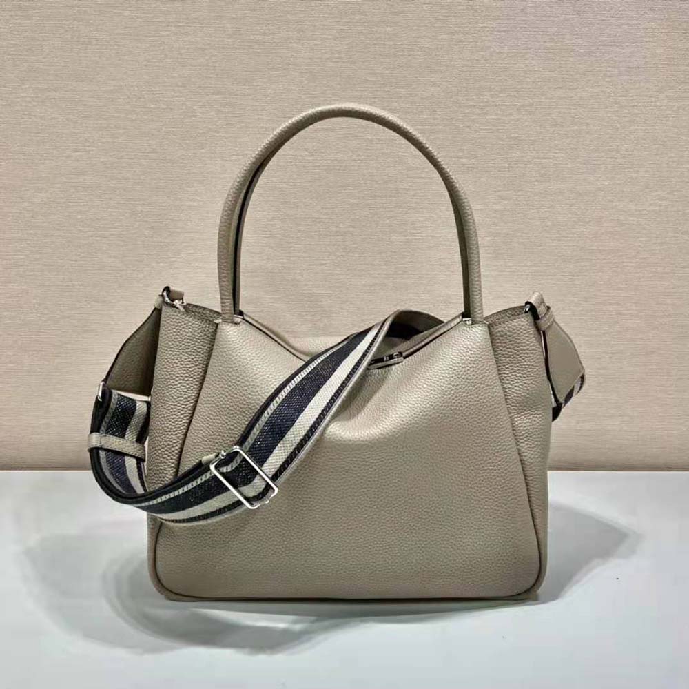 Side angle showing spacious interior of Prada Women Large Leather Handbag