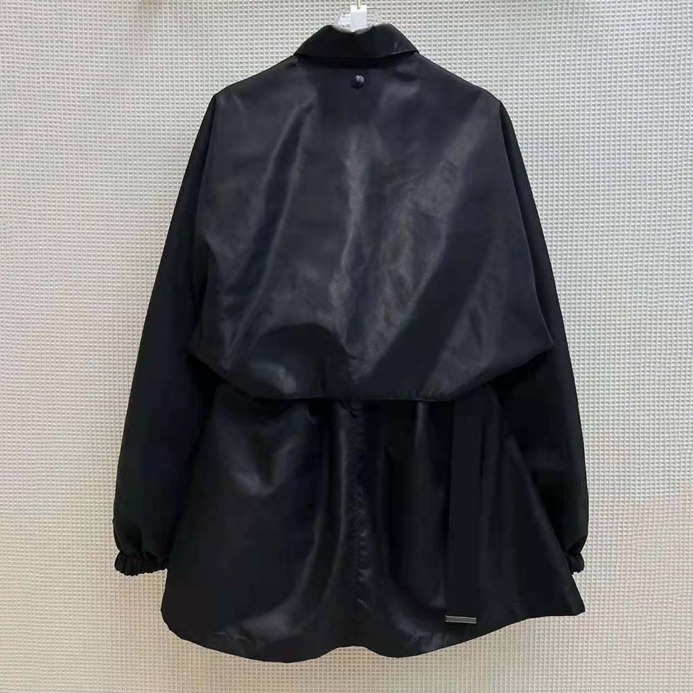 Side profile showing adjustable waist tabs on Prada Light Re-Nylon jacket