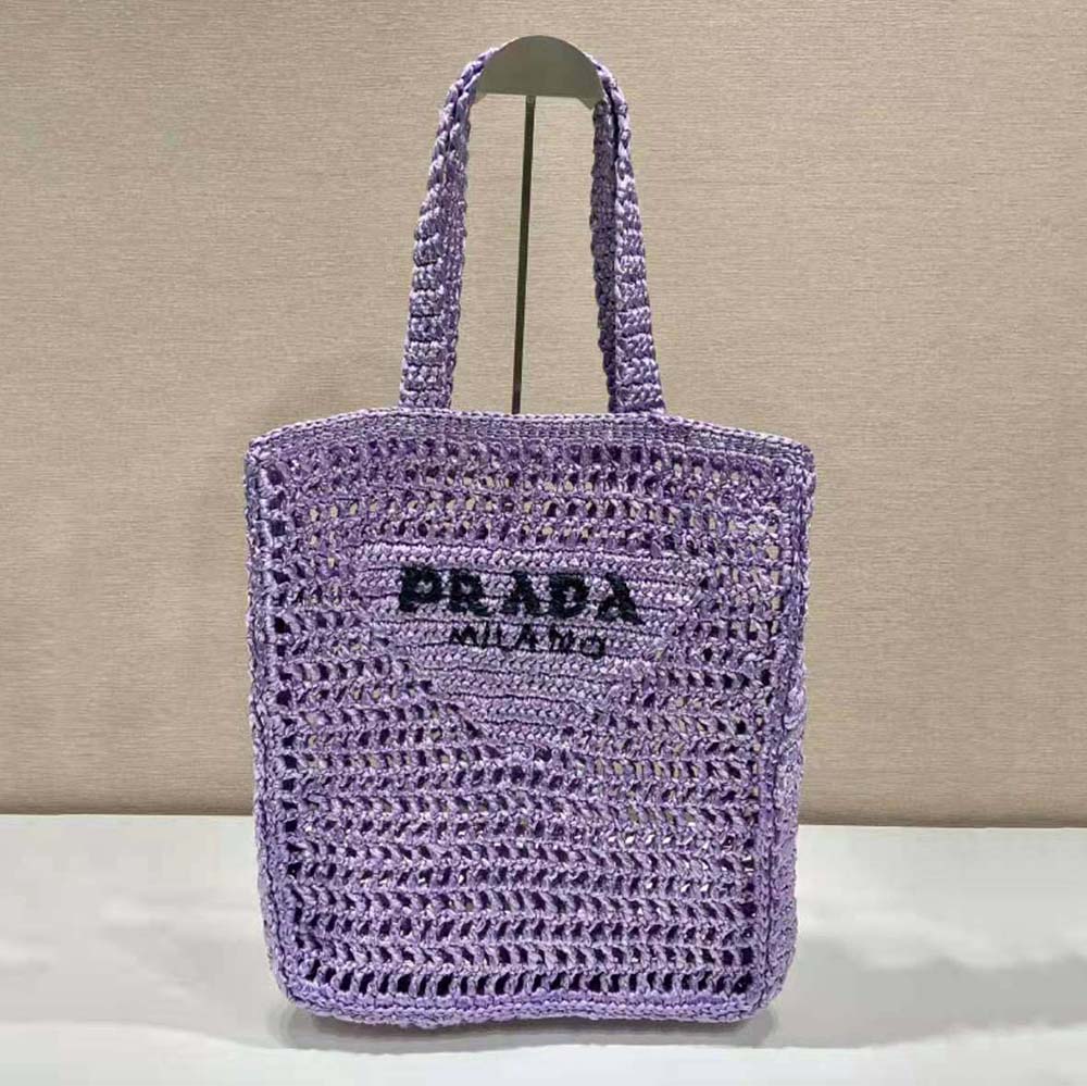 Close-up of soft-purple raffia texture and Prada logo detail
