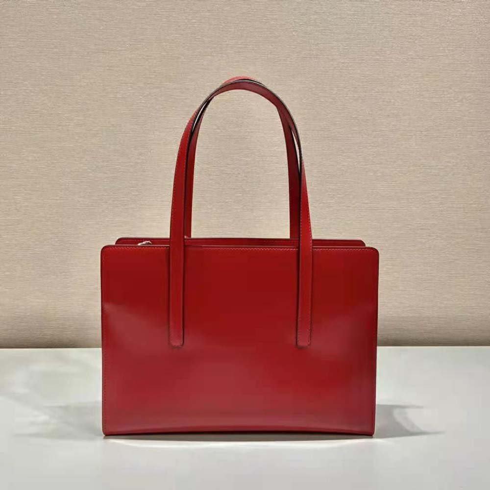 Side angle showing silhouette of Prada Women Re-Edition 1995 Medium Handbag-Red