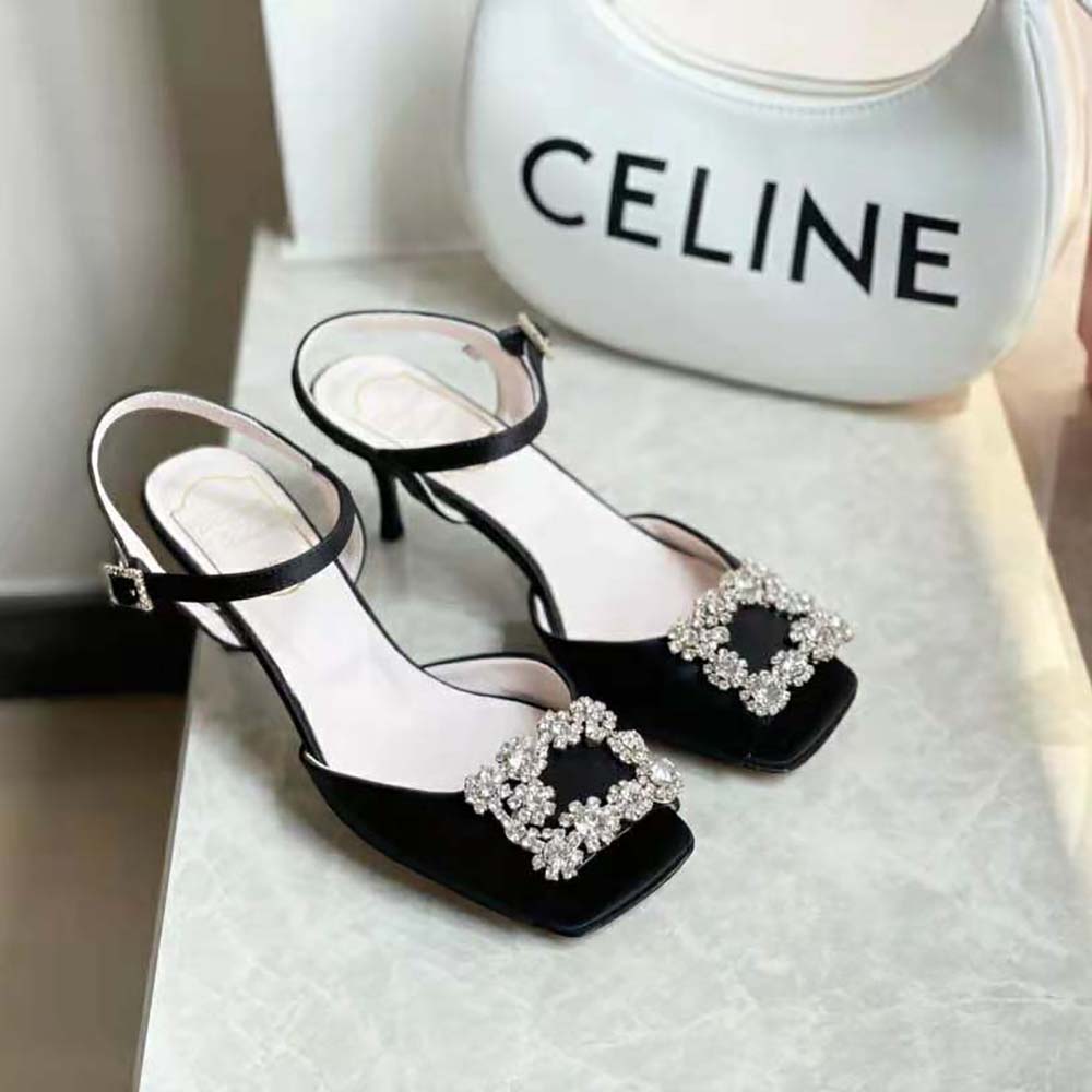 Side profile highlighting heel and ankle strap of Roger Vivier black satin sandals