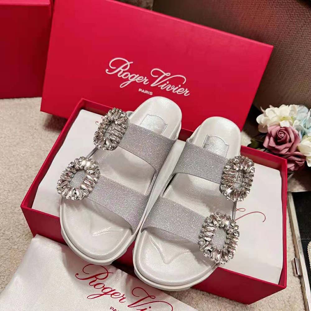 Close-up of sparkling strass buckle on Roger Vivier Slidy Viv sandals