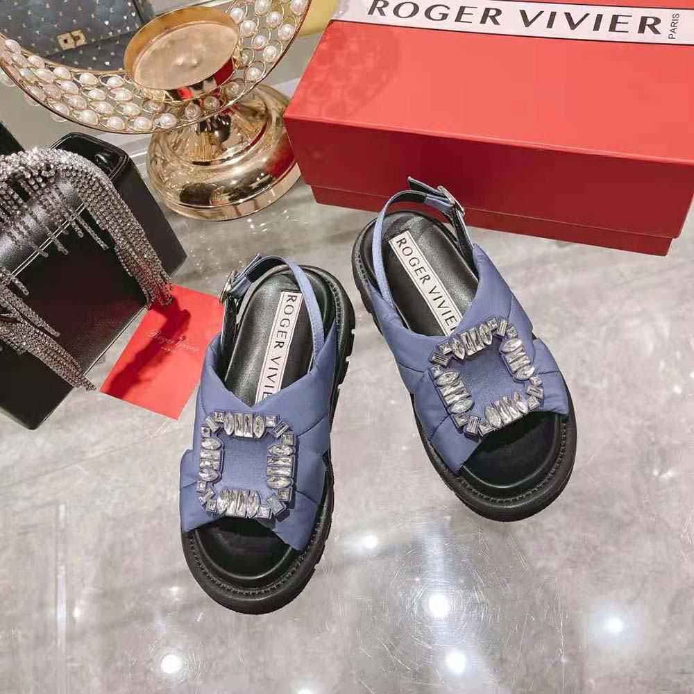 Close-up of sparkling strass buckle on Roger Vivier Satin-Navy sandals