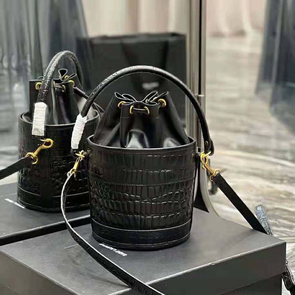 Close-up of gold YSL hardware on Bahia Small Bucket Bag