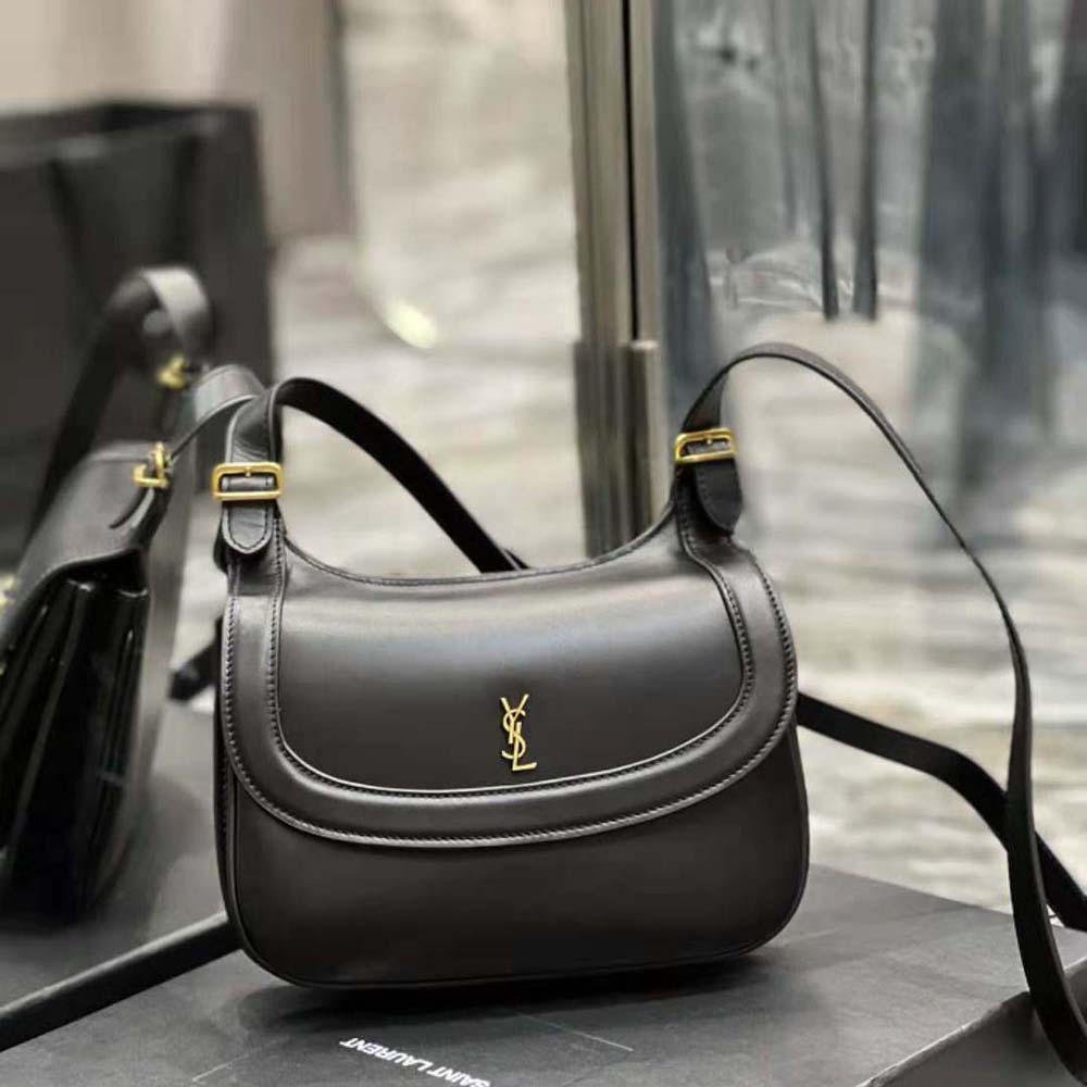 Side angle showing flap closure and adjustable strap of Saint Laurent YSL bag