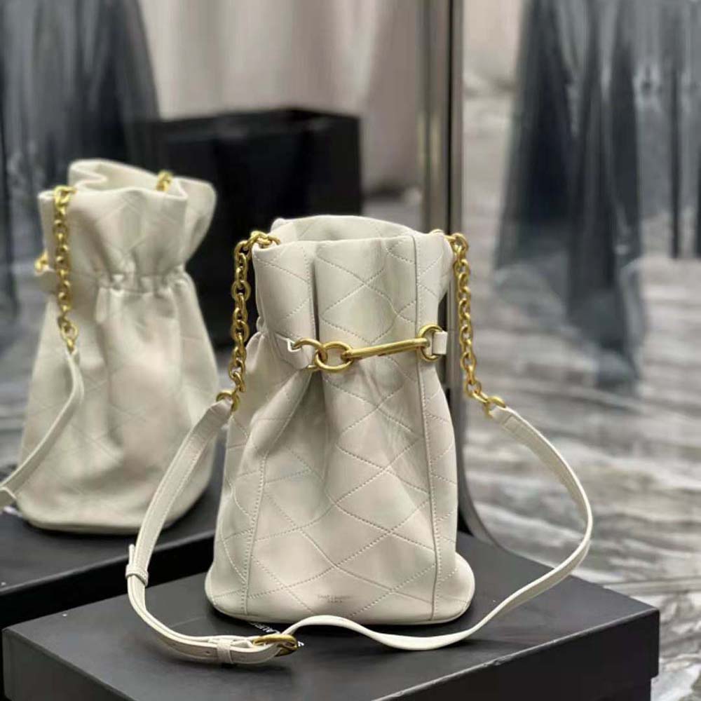Close-up of gold Le Maillon chain detail on Saint Laurent YSL bucket bag