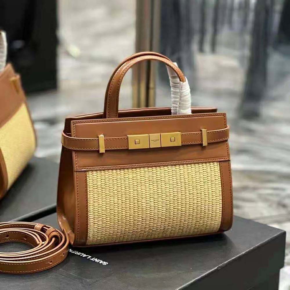 Close-up of gold YSL logo and smooth leather flap on Manhattan Nano Shopping Bag