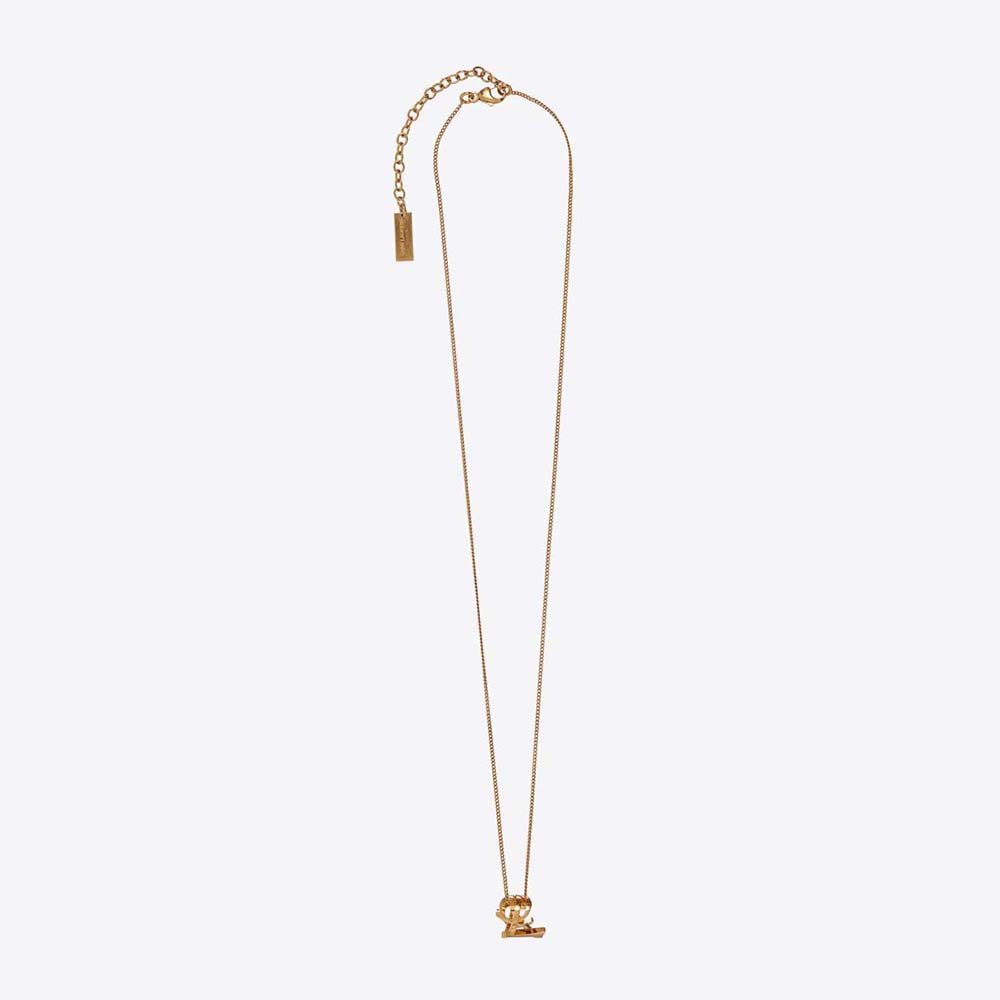 Close-up of Saint Laurent YSL Women Monogram Twist Pendant Necklace gold pendant detail