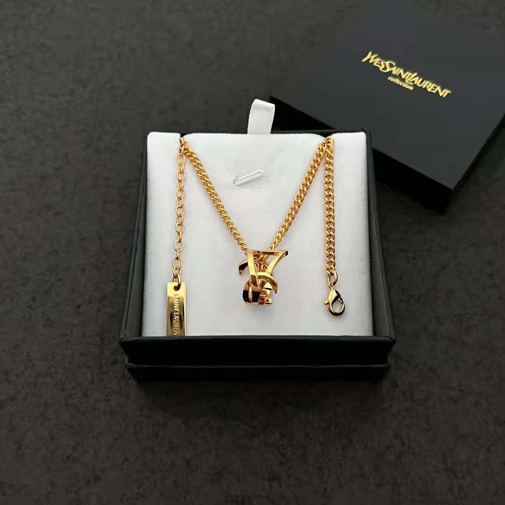 Full view of Saint Laurent YSL Women Monogram Twist Pendant Necklace hanging on display