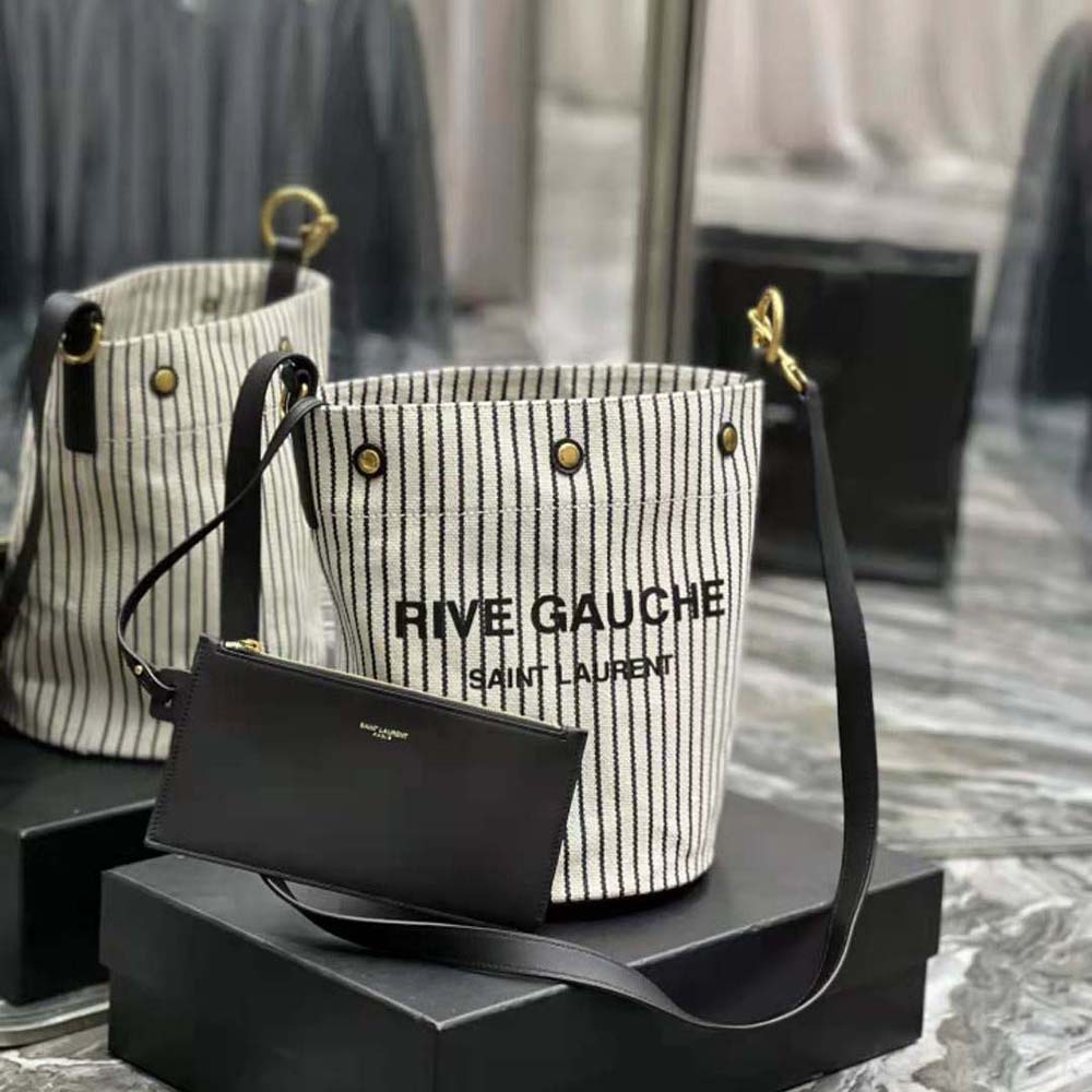 Close-up of gold YSL logo and drawstring on Saint Laurent YSL Women Rive Gauche Bucket Bag