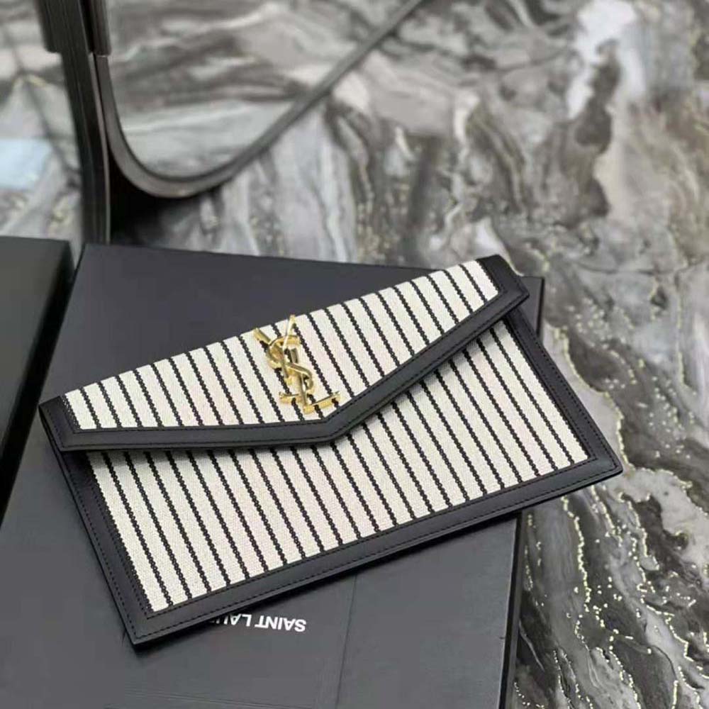 Side angle showing smooth leather and canvas texture on Uptown Pouch