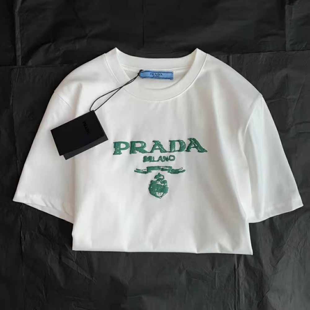 Side angle showing subtle Prada logo detail on sleeve of the T-shirt
