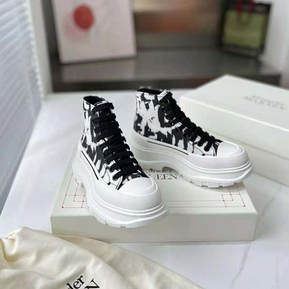 Front view showing lace-up and leather texture on Alexander Mcqueen white boot