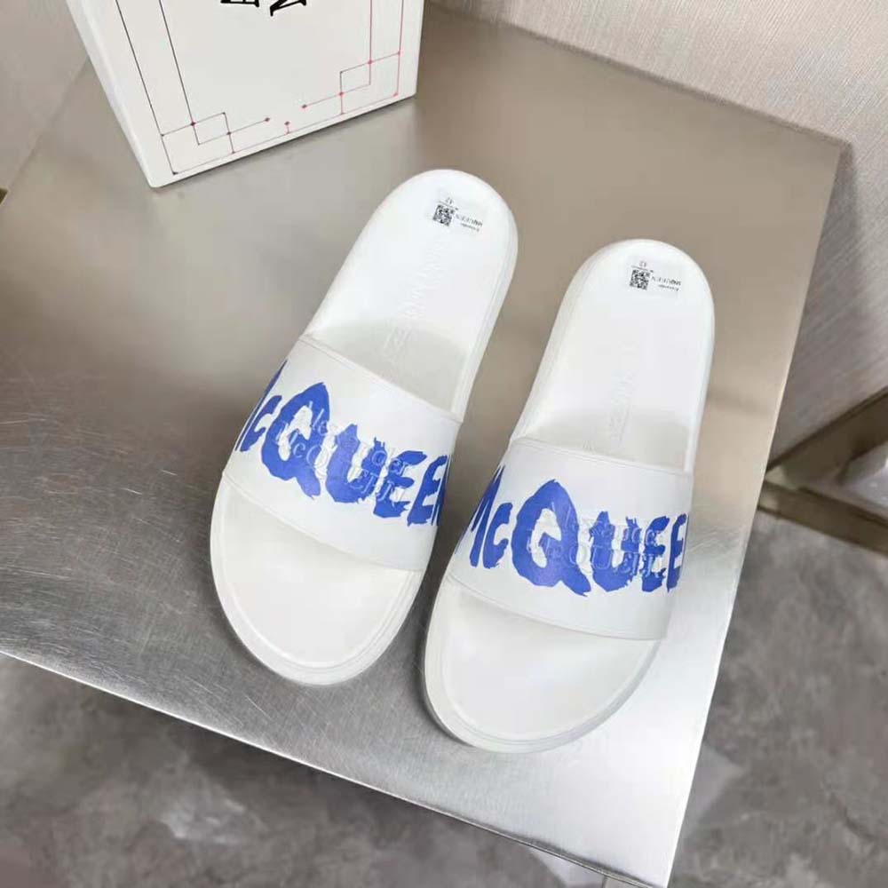 Close-up of blue graffiti detail on Alexander Mcqueen Rubber Pool Slide