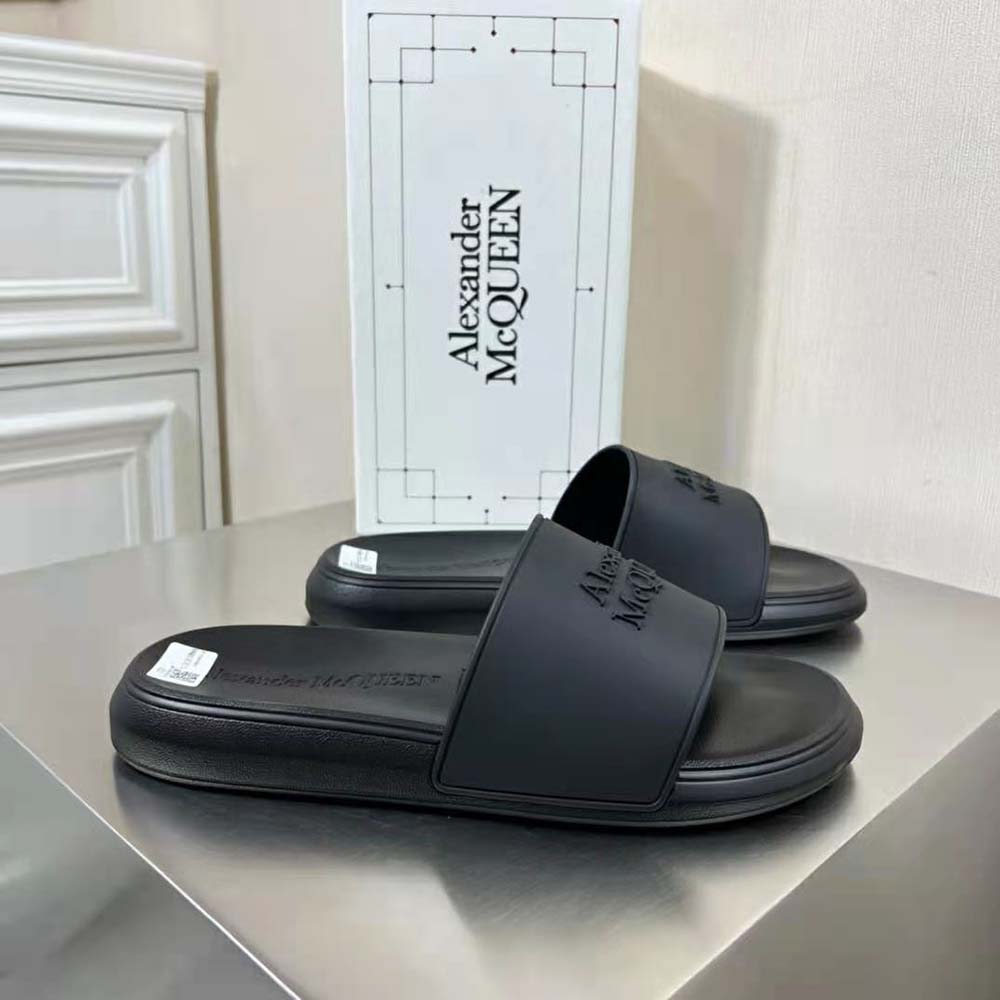 Close-up of embossed logo on Alexander Mcqueen Unisex Pool Slide strap