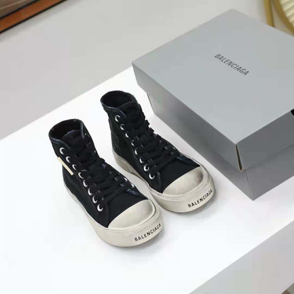 Close-up on destroyed cotton texture of Balenciaga Paris High Top Sneaker