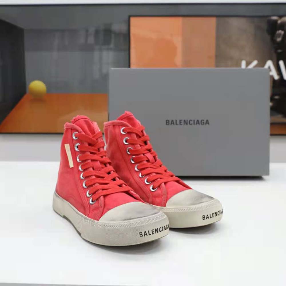 Top-down angle showing high-top silhouette and embossed logo on Balenciaga sneaker