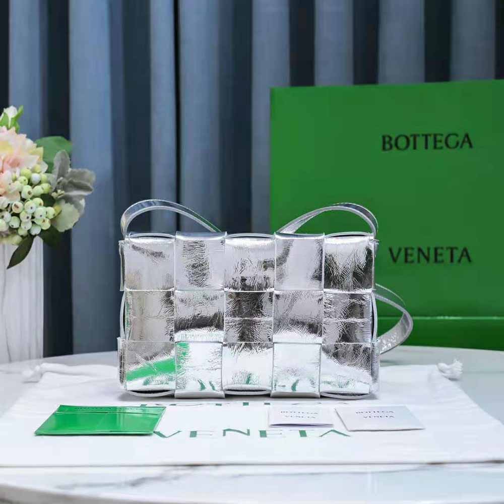 Side angle showing silver hardware and magnetic closure on Bottega Veneta cross-body bag