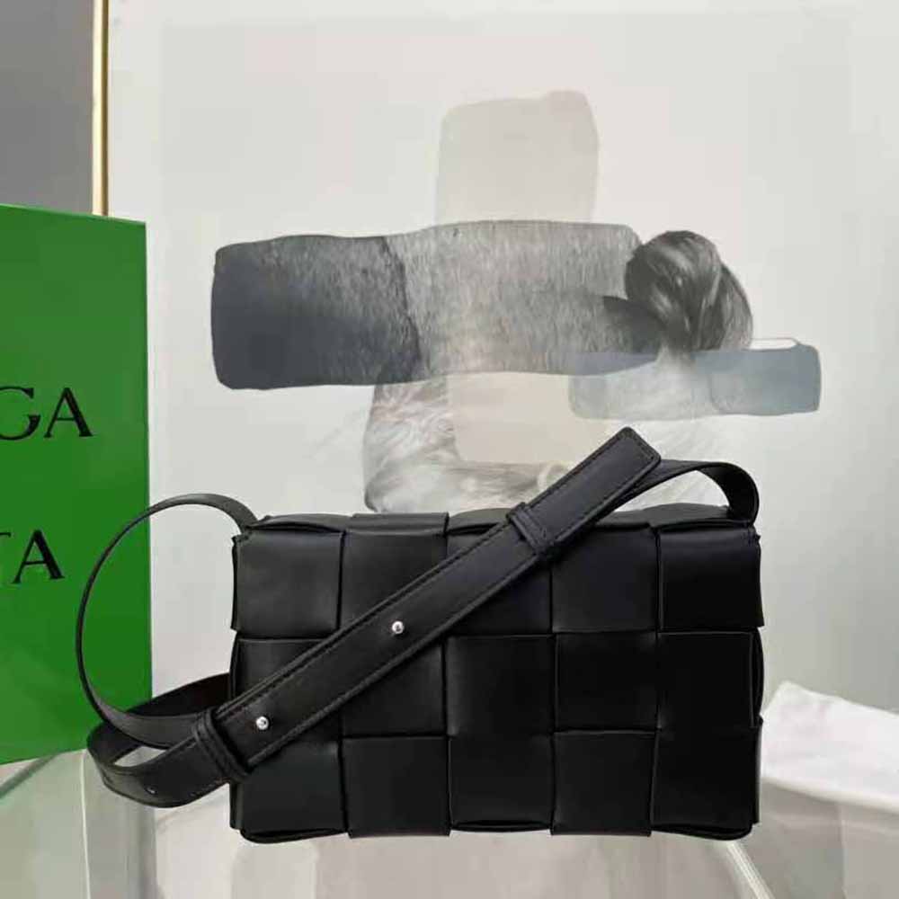 Side angle showing gold-tone hardware on Bottega Veneta Cassette Cross-Body