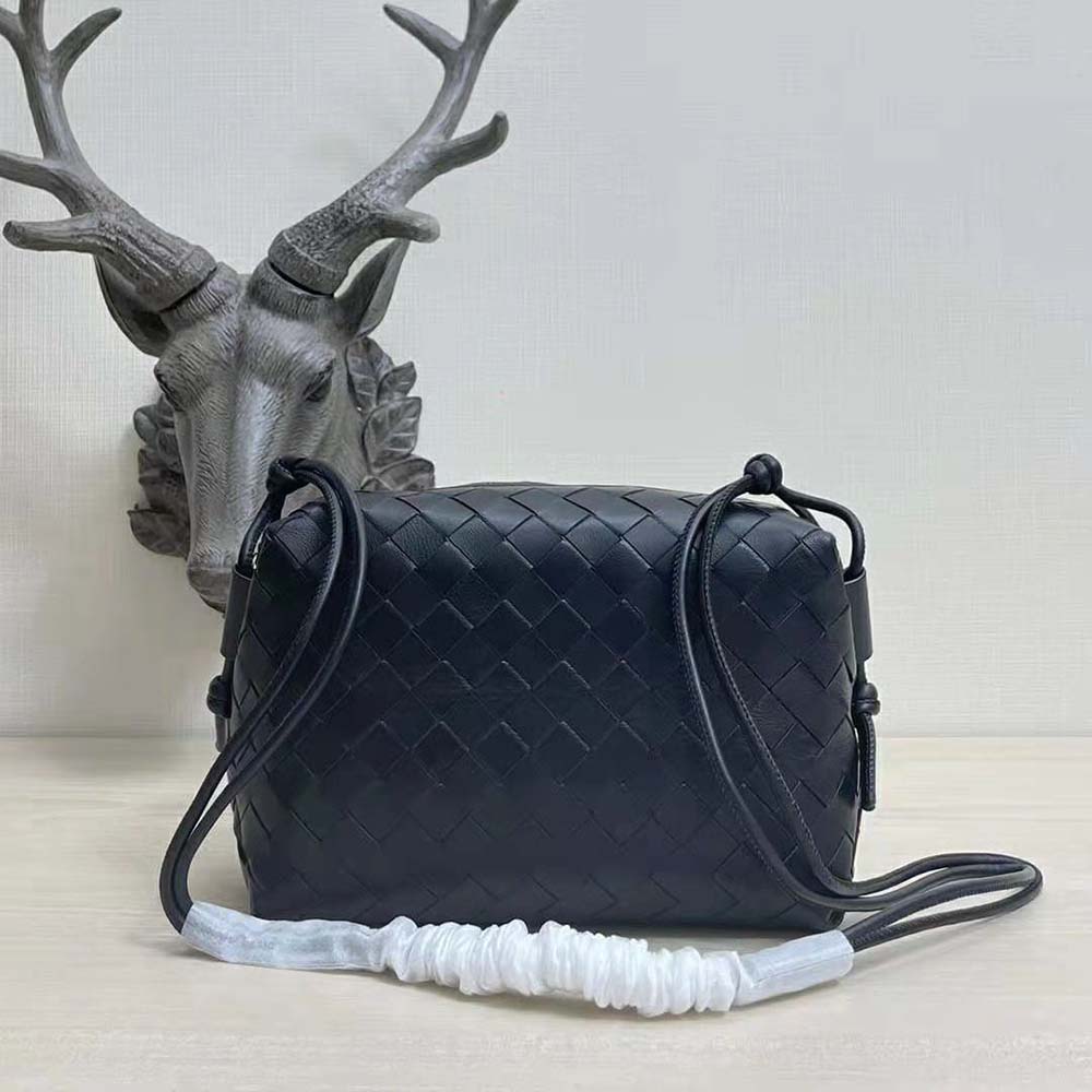 Side angle showing compact silhouette of Bottega Veneta Women Loop Small Intrecciato Leather Cross-Body Bag-Black