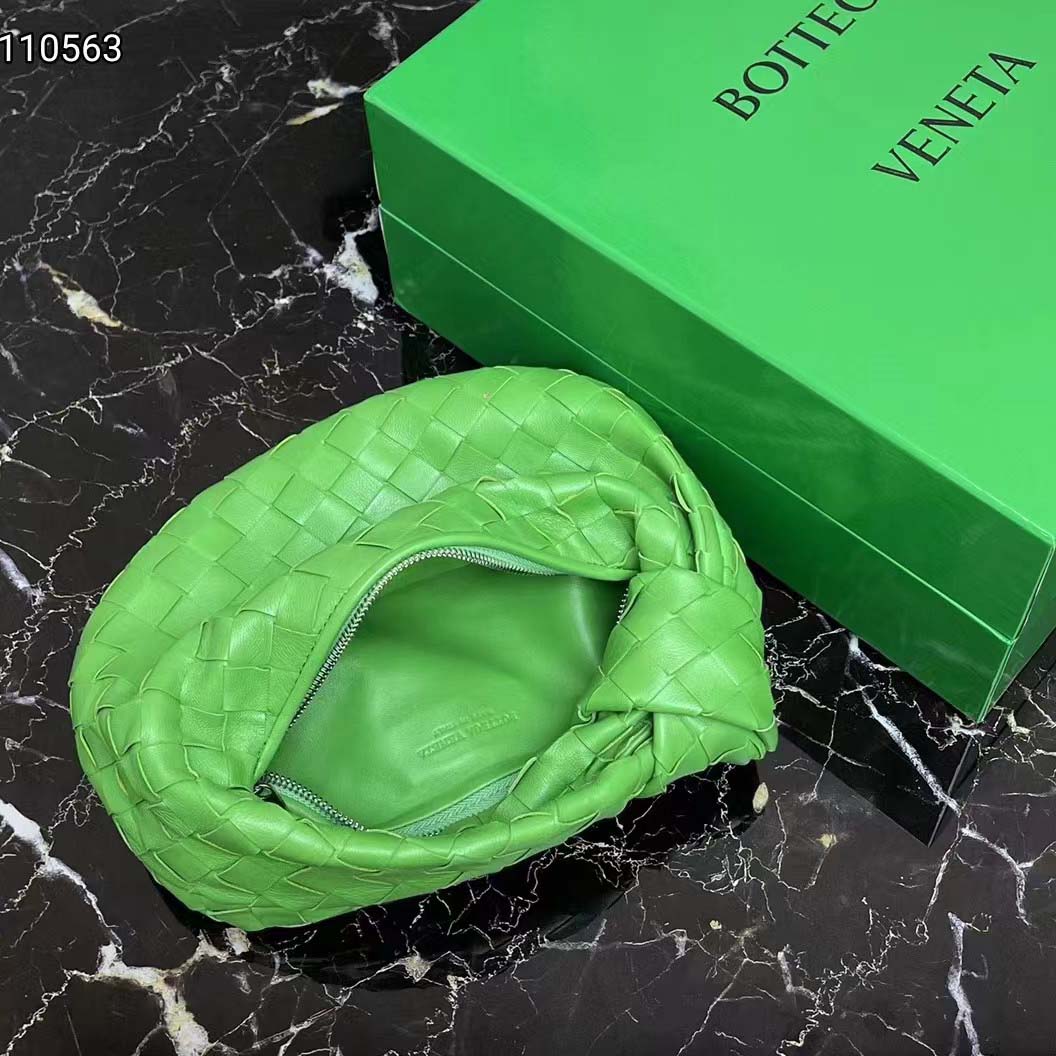 Side angle showing matte gold hardware on Bottega Veneta Mini Jodie Parakeet Green tote