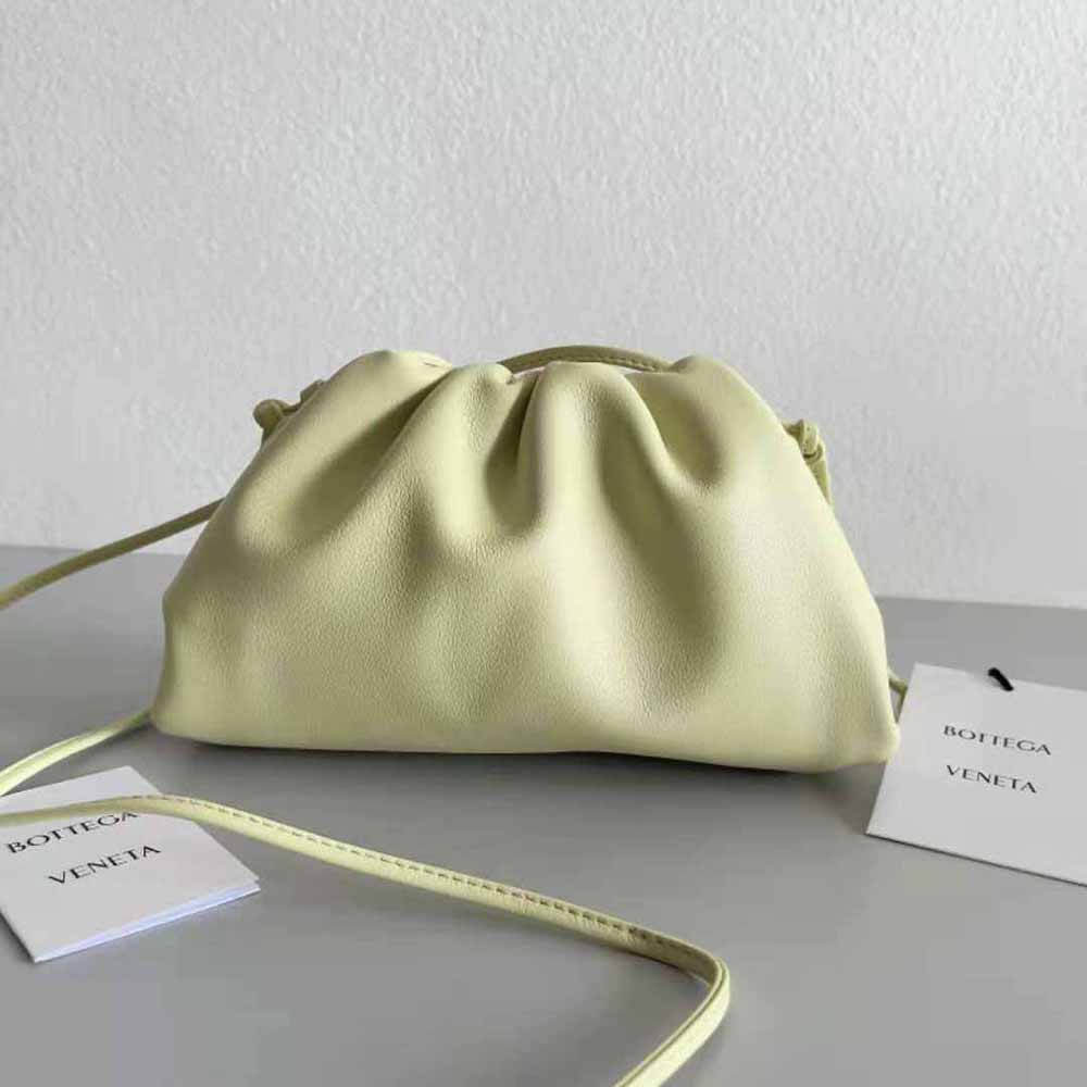 Close-up of intrecciato weave and gold hardware on Bottega Veneta mini pouch