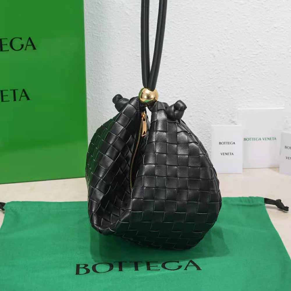 Side profile showing adjustable strap on Bottega Veneta leather pouch