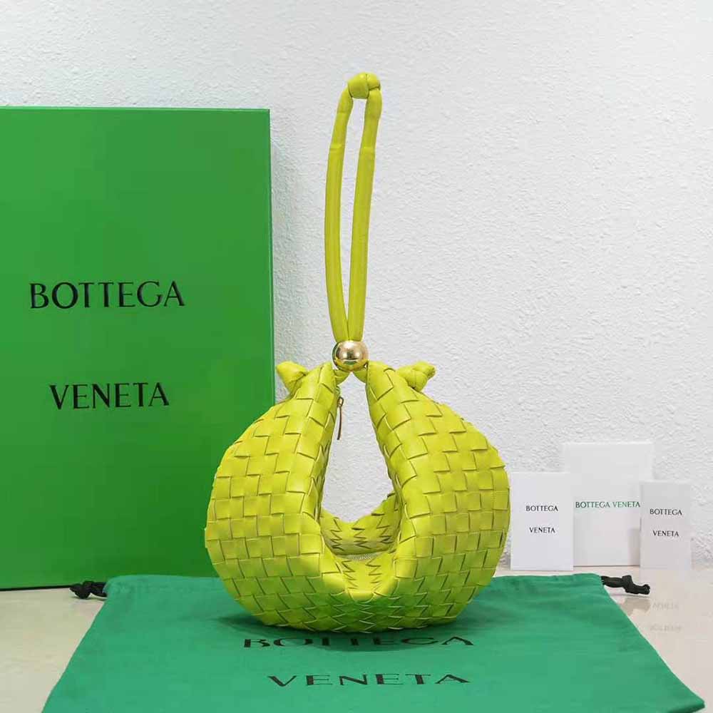 Close-up of lime intrecciato leather texture on Bottega Veneta pouch