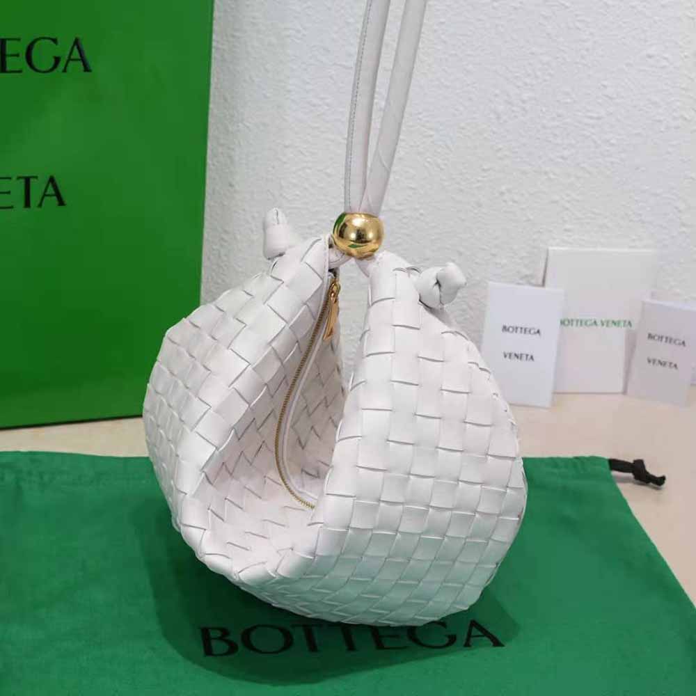 Side angle showing adjustable strap on Bottega Veneta white pouch