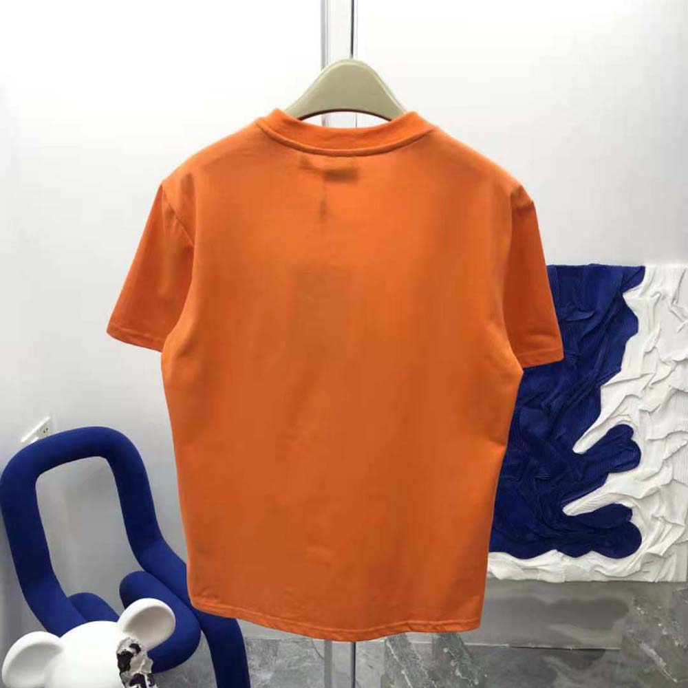 Side angle showcasing fit of Burberry Women Cotton Oversized T-shirt in orange
