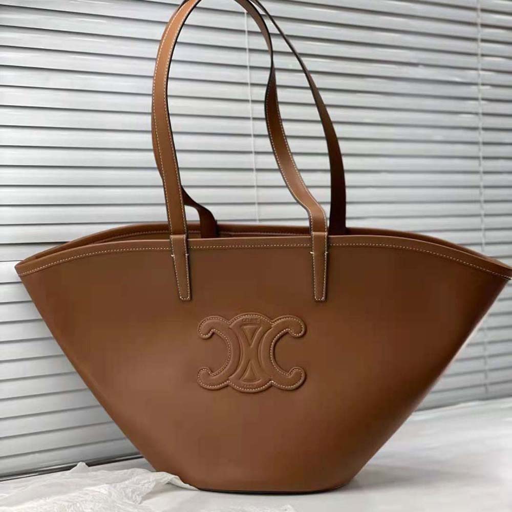 Close-up of gold-tone Triomphe hardware on Celine medium handbag
