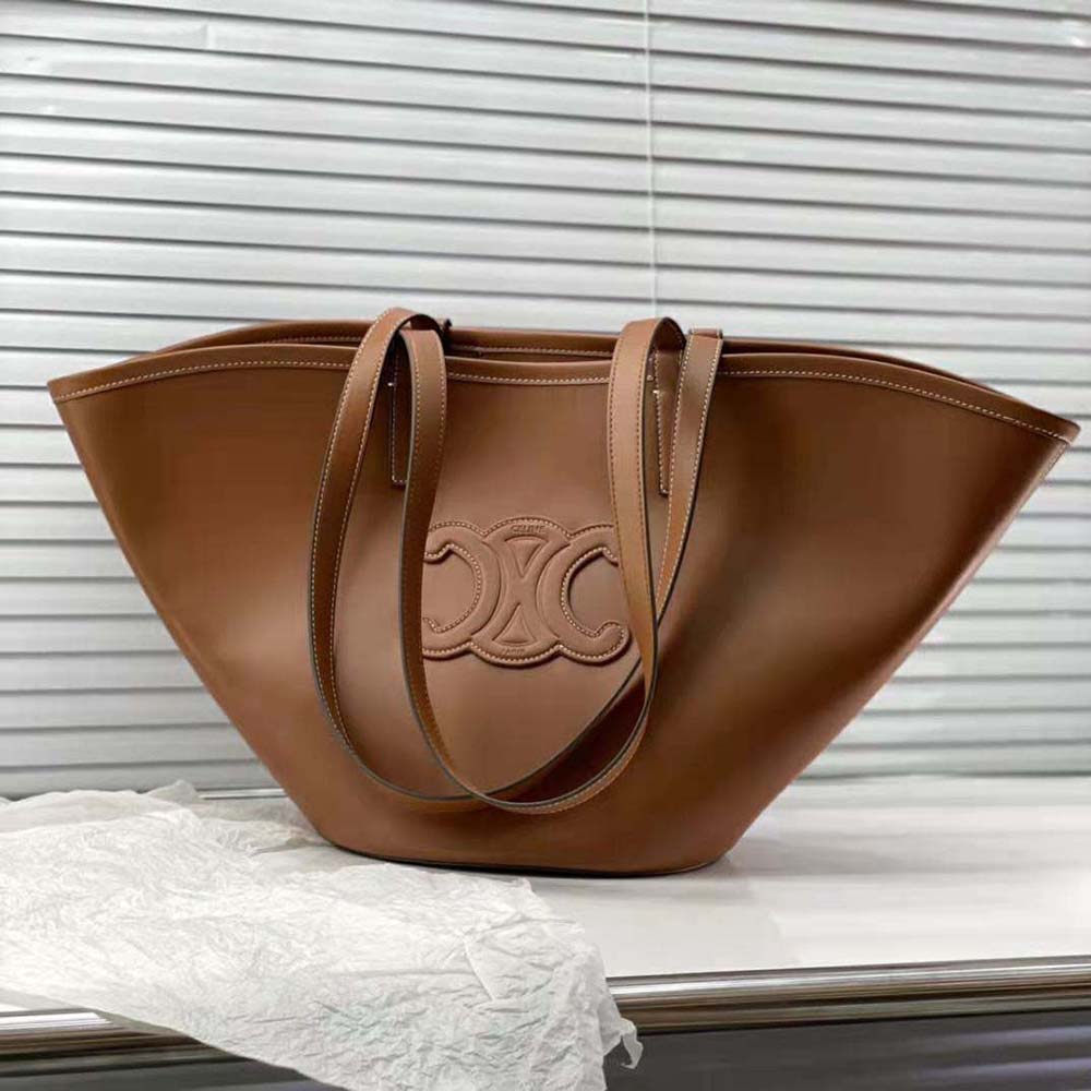 Side angle showing structured silhouette of Celine Women Medium Couffin bag