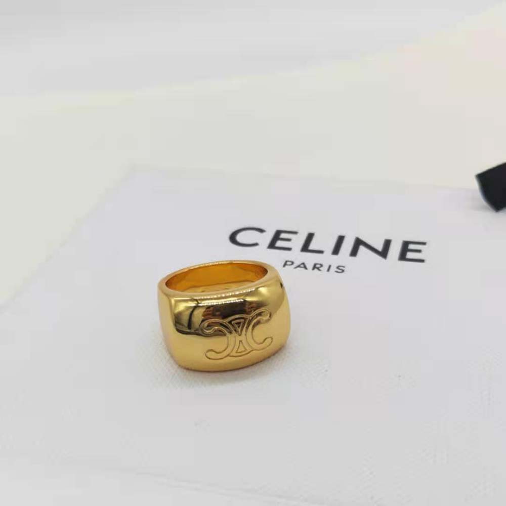 Styled wrist with Celine Women Triomphe Bold Ring in brass gold