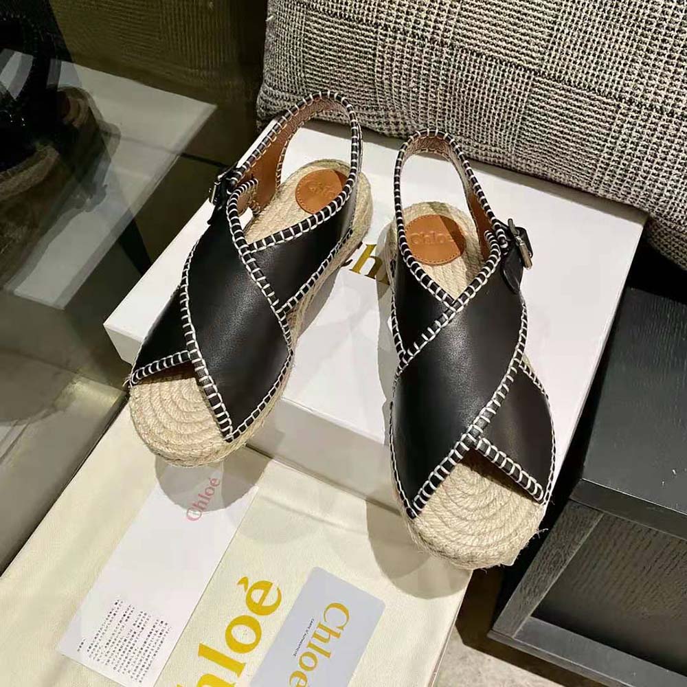 Close-up of black leather tassel detail on Chloe Women Lucinda Flat Espadrille-Black