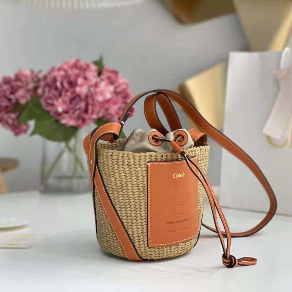 Side angle showing basket weave texture of Chloe Women Small Basket in Orange