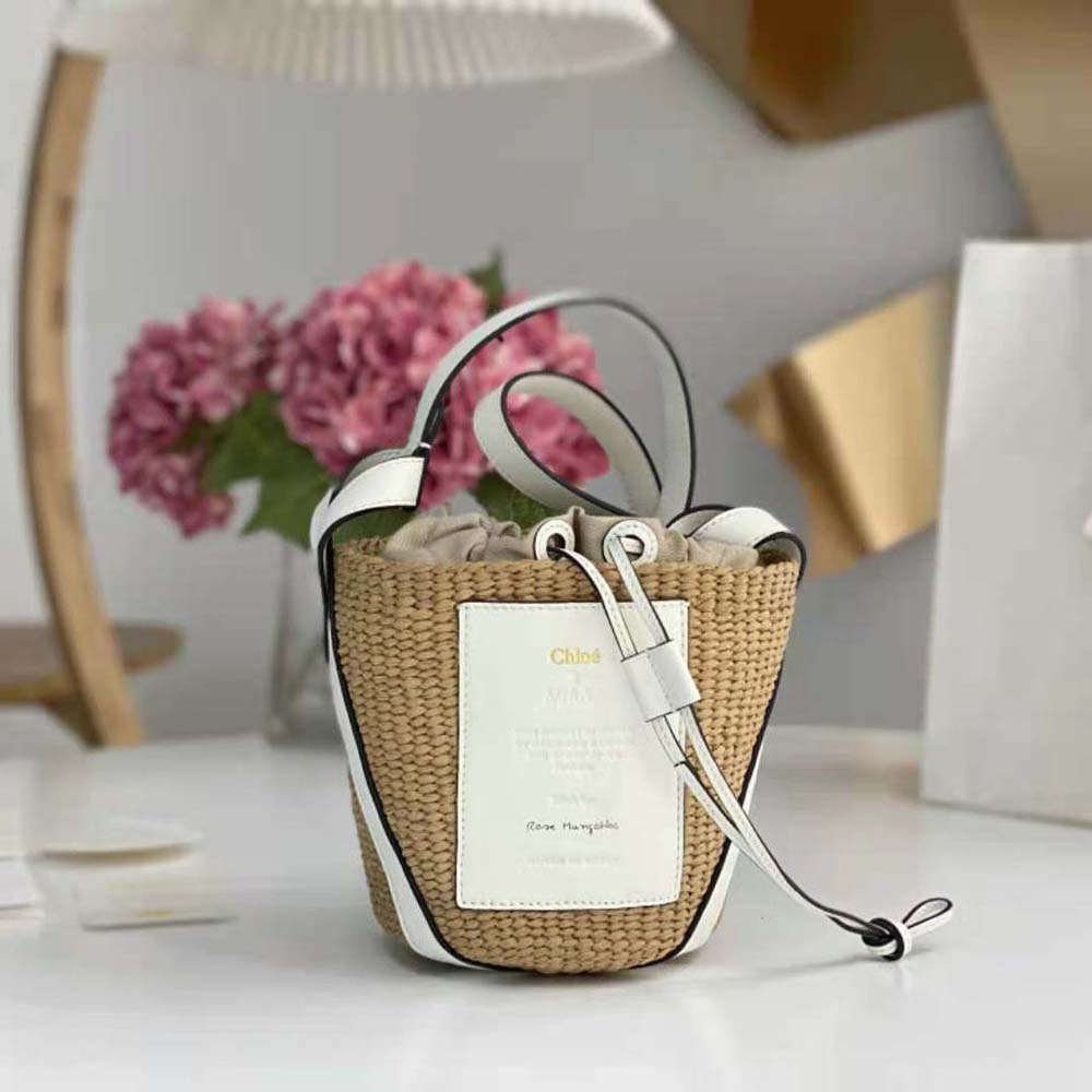 Close-up of white calfskin and gold hardware on Chloe Women Small Basket