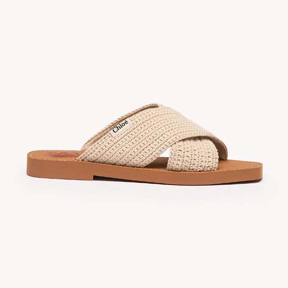Side angle of Chloe Women Woody Flat Mule-Beige highlighting wood-effect sole