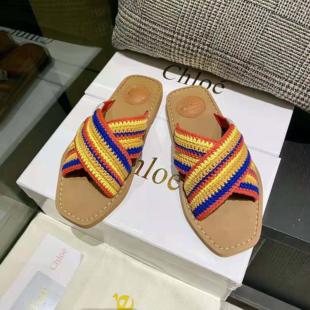 Close-up detail of yellow leather and embossed Chloé logo on mule