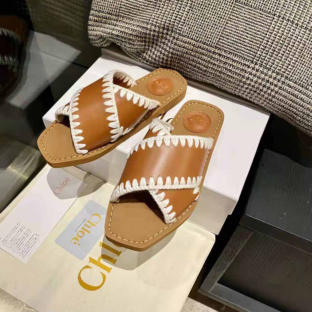 Sole detail of Chloe Women Woody Flat Slide-Brown highlighting woody texture
