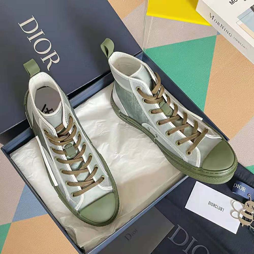 Close-up showing Dior Oblique canvas and lace details on sneaker