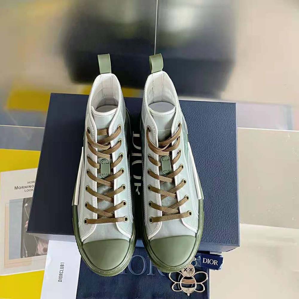 Rear angle highlighting high-top silhouette and rubber sole of sneaker
