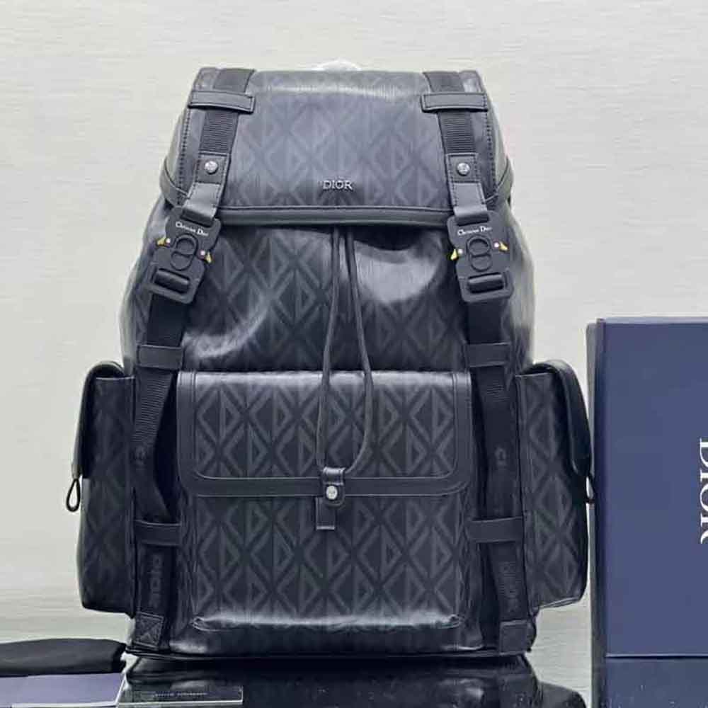 Close-up of silver-tone CD hardware on Dior Men Hit the Road Backpack