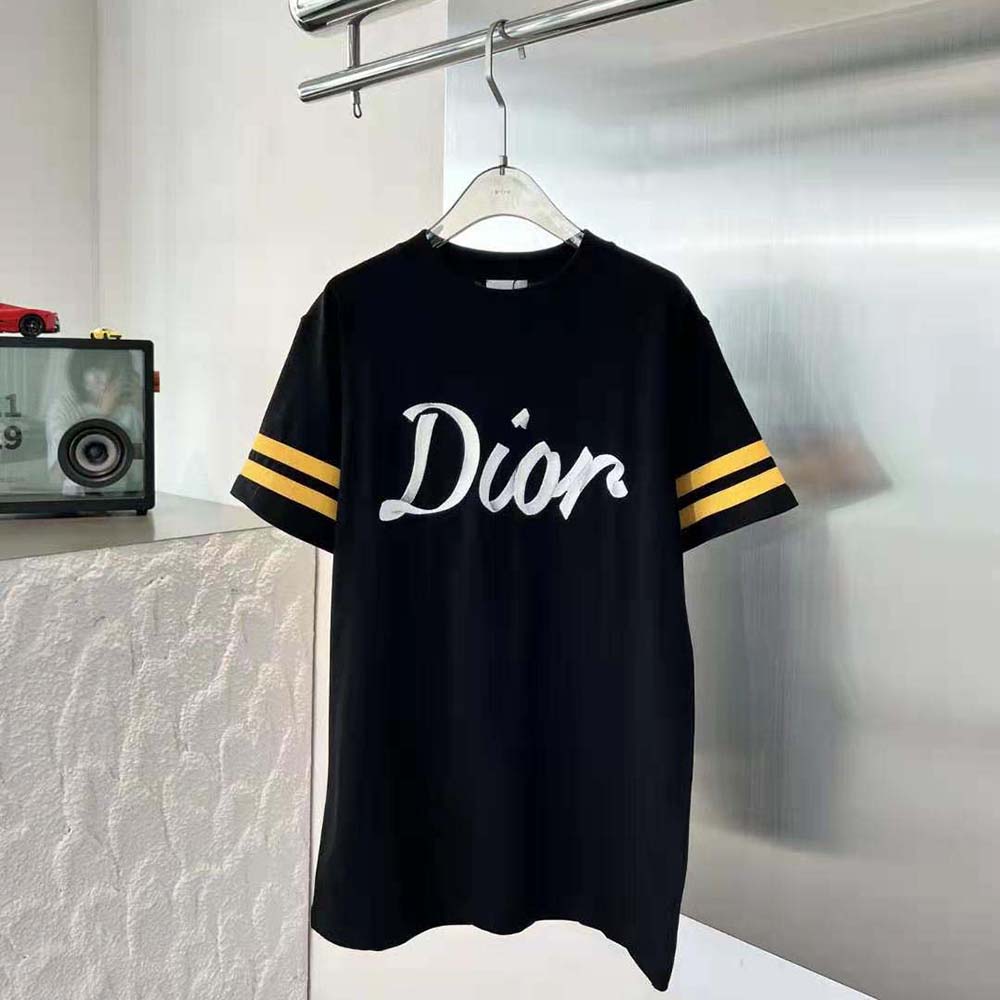 Close-up of Dior logo on black organic cotton T-shirt chest