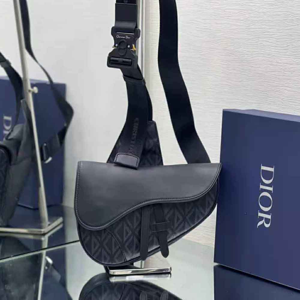 Close-up on silver-tone CD hardware on Dior Men Saddle Bag Black