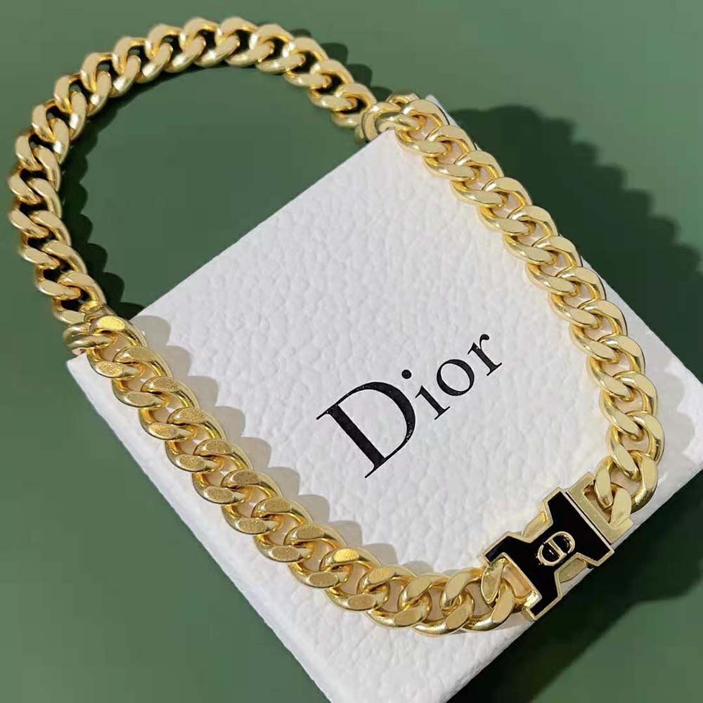 Close-up of black lacquer and gold-finish details on Dior Women 30 Montaigne Necklace