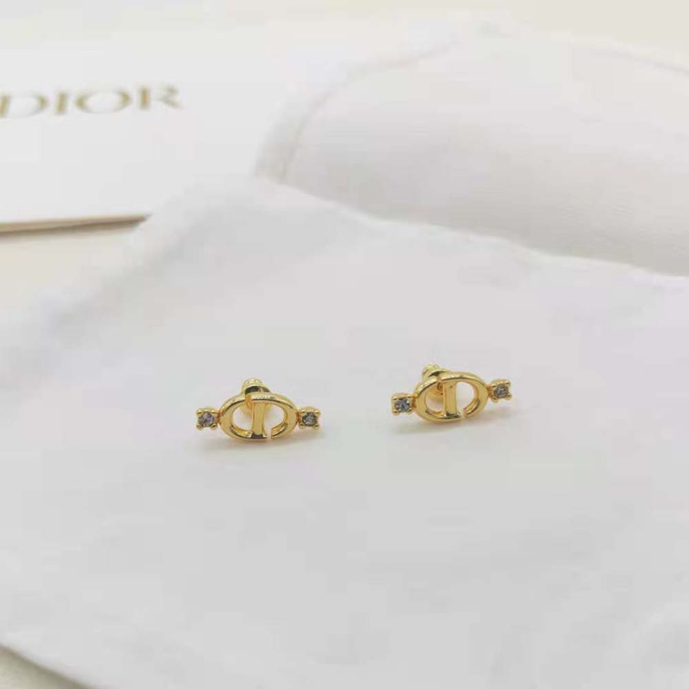 Close-up detail of silver-tone crystals on Dior Women CD Navy Stud Earrings