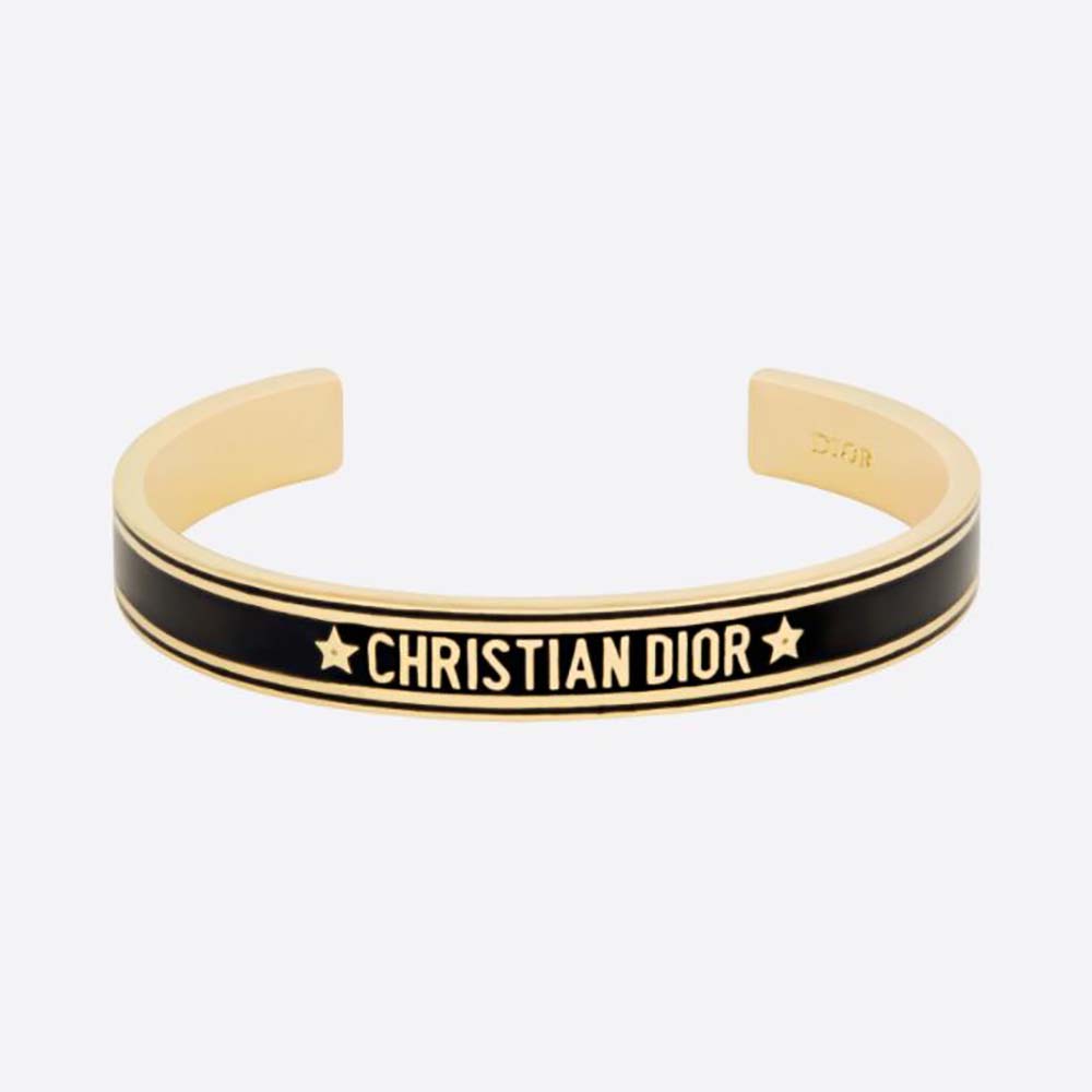 Close-up of Dior Women Code Bangle gold-finish metal and black lacquer