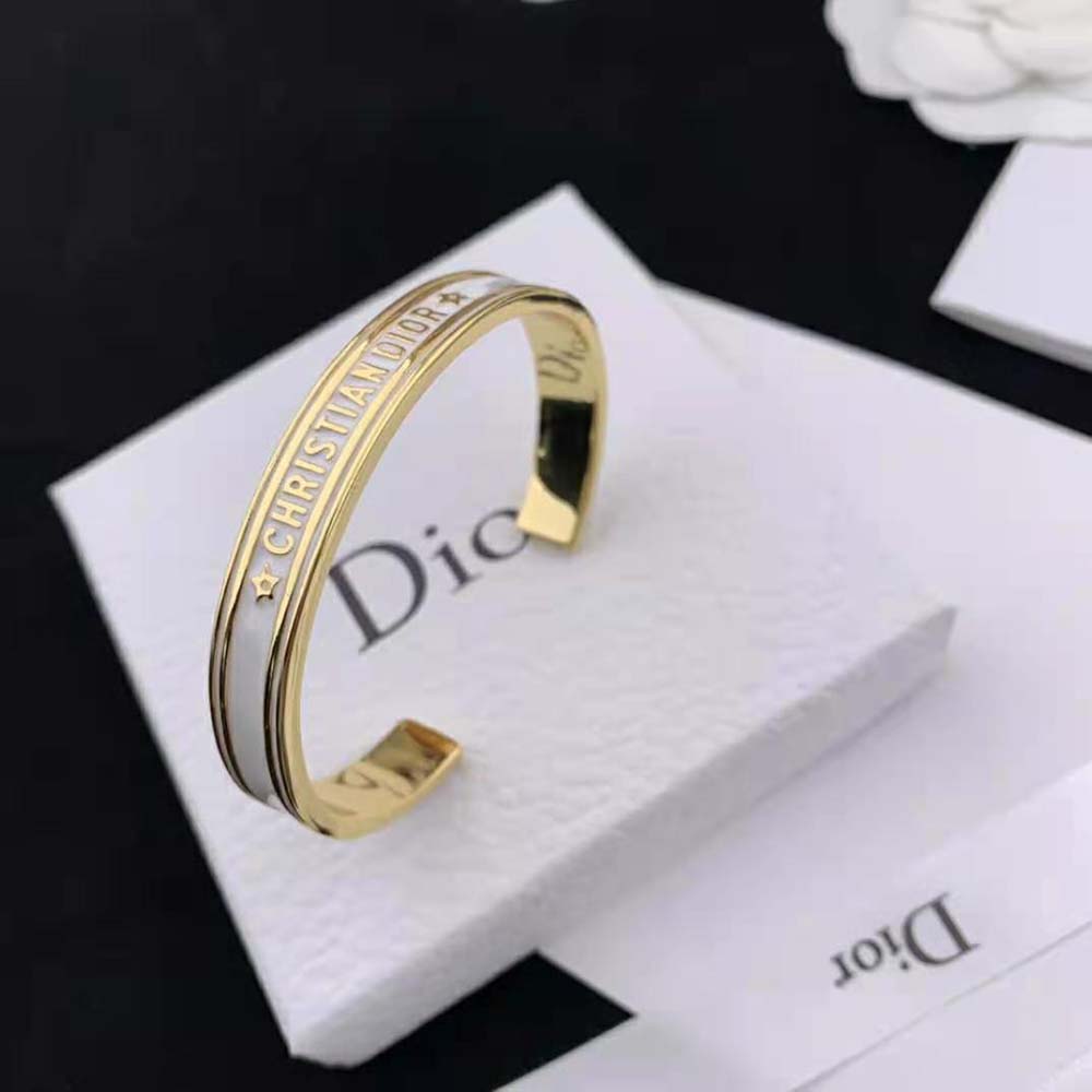 Side angle of Dior Women Code Bangle showcasing sleek white lacquer surface