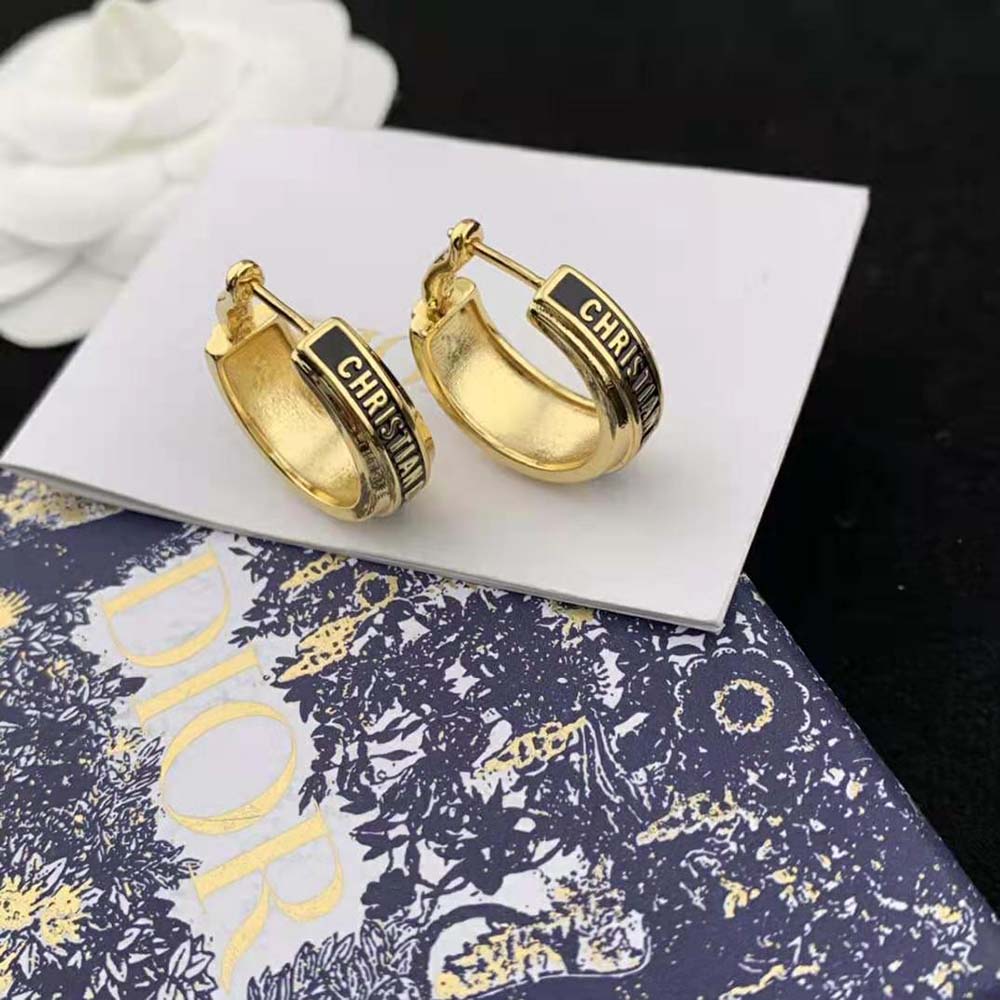 Side angle showcasing silhouette of Dior Women Code Earrings in black and gold